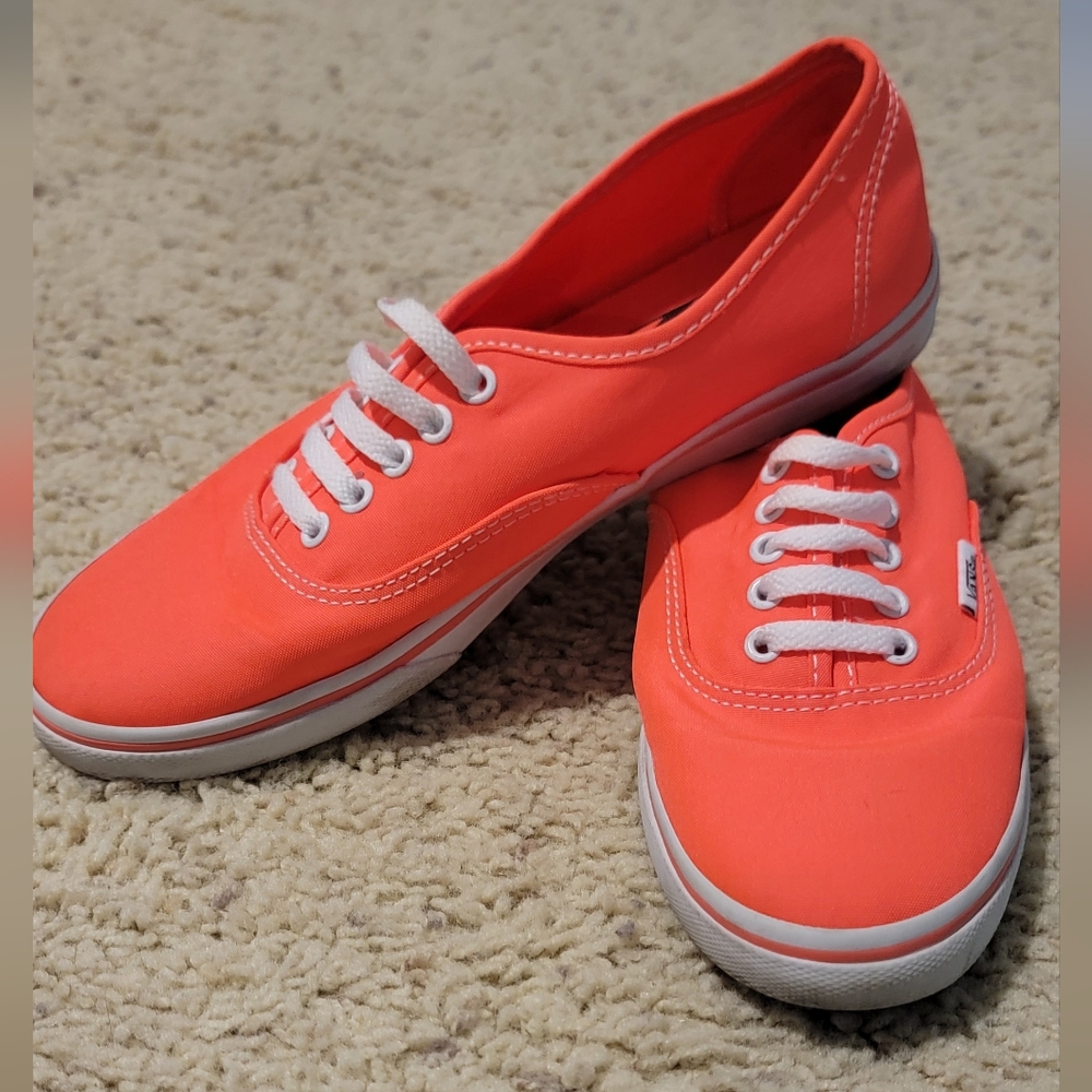 Bright pink/orange slip on vans